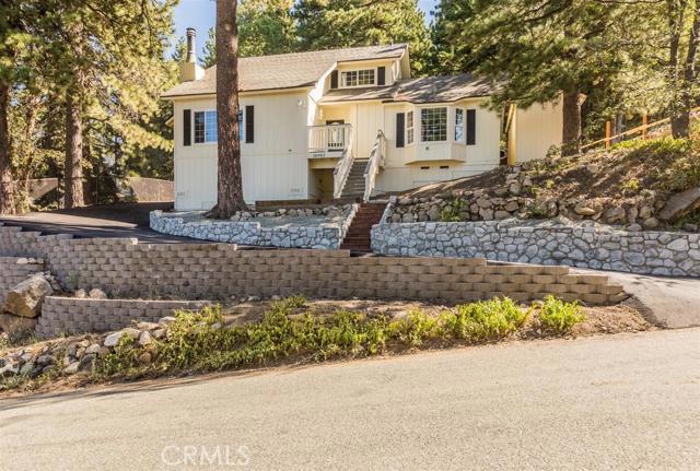 RUN FOR THE HILLS! Up here you will find a safe haven from the frantic pace of city life. Put the to do list down, because this house is turn-key and newly remodeled with a view of the city lights at night. A long list of comforts includes engineered hardwood floors, an updated kitchen and bathrooms, air conditioning, dual paned windows, and plenty of storage including cedar closets. You'll also find new high-quality carpeting throughout along with a tankless water heater and wood-burning stove. If that isn't enough, the outdoor area features a basketball hoop, shed, and covered porch area so that you can relax and unwind at the end of the day. Come see for yourself and prepare to fall in love!