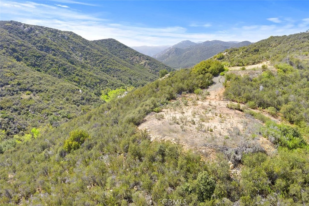 SELLER FINANCING AVAILABLE!!!! 9+ ACRES OF PRIVACY & VIEWS. THIS ONE IS GORGEOUS AND PRICED TO SELL! Enjoy stunning mountain views from this nine-acre parcel on the Santa Rosa Plateau. Adjacent 9-acre parcel also available! Build your dream home and enjoy the “La Cresta Lifestyle” of open spaces, clean air, serenity and star-filled skies. This part of the Plateau is very quiet and feels worlds away, yet it is actually just minutes to the convenience of schools, restaurants, hospitals, shopping, Historic Old Town Murrieta and the 15 Freeway. This area is also within the La Cresta Highlands POA, where their current minimum square footage for primary residences is only 2000 square feet, making getting started easy and cost-effective. Paved roads lead to the property. City water is at the street and the water bond has been paid! Let your imagination run wild, as you consider building an off-grid home, taking advantage of innovative solar and battery technology. Your country dream home is calling! *** 5-acre minimum parcels (10-acre minimum in SR West), just minutes to schools, restaurants, hospitals, grocery stores, 15 Fwy & Temecula Wine Country. Enjoy this peaceful ranch community with no commercial businesses, robust social activities, miles of private community trails & 1000s of acres of Ecological Reserve…All less than 1.5 hours from LA, SD, OC, Palm Springs & Big Bear. Discover the country, yet convenient, lifestyle of La Cresta, Tenaja & the Communities of the Santa Rosa Plateau!