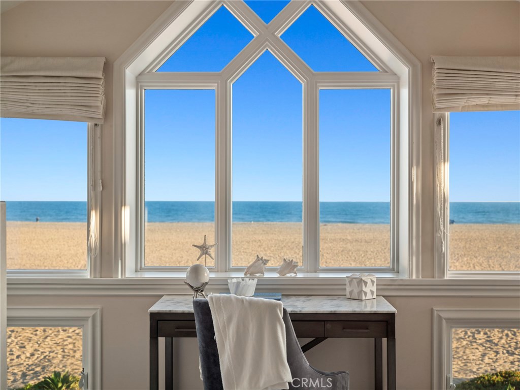 Situated on a serene oceanfront site in Newport Beach, this beautiful, approx. 3,795 sf custom residence features panoramic ocean views stretching from the Newport and Balboa piers to Catalina and vibrant sunset views. Appealing traditional and Cape Cod architectural influences, combined with high-quality finishes and craftsmanship, create a lovely 4 bedroom, 4.5 bath seaside home that will be enjoyed for generations. Designed for effortless coastal living, the main level encompasses a gourmet kitchen, living room, dining room, and two breakfast nooks - all with spectacular views - and all opening to the inviting beachfront patio just steps from the sand and surf. The upper level showcases a large master suite with walls of windows to take in the breathtaking views, as well as a fireplace, spa bath and oceanfront balcony. Other highlights include a rooftop deck, office with extensive custom built-ins, spacious secondary bedrooms and 3-car finished garage. An eye for detail and enduring style is evident throughout the home, with bespoke finishes and amenities including coffered ceilings, custom millwork, professional-grade appliances, granite countertops, central vacuum and dumbwaiter. Ideally located on the Newport Peninsula close to Lido Marina Village and the Newport Harbor Yacht Club.
