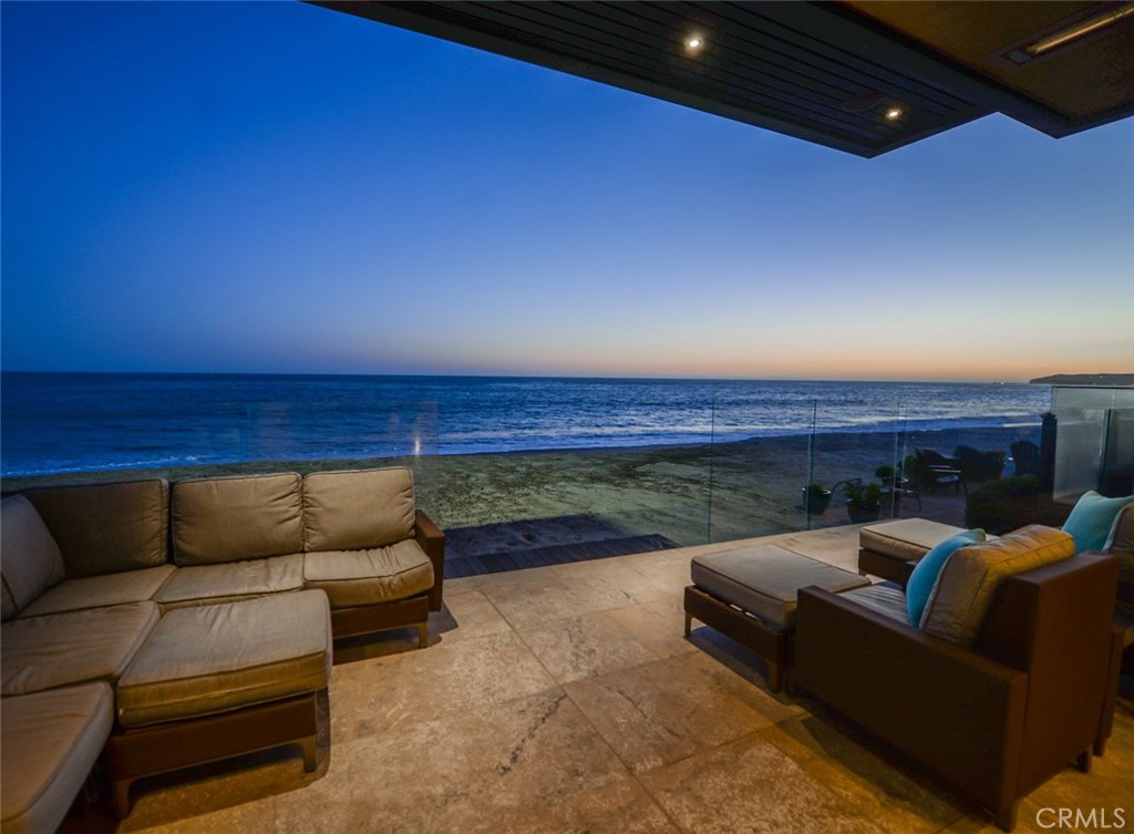 Breathtaking panoramic ocean views surround this rare newer construction home on the sand in the exclusive gate guarded private community of Capistrano Beach. Thoughtfully designed by Carol McMahon and built with the highest quality of craftsmanship this gorgeous multi-level 4082 sq ft home is ready to hand you the key and enjoy for the summer. Rarely used and meticulously cared for since completion in June 2013 this custom home looks/feels like new with wide open floor plan and massive glass rooftop for natural light. Airy and bright, the stylish living spaces include a formal living room with tile framed gas fireplace and 70” TV, formal dining area, chef’s kitchen fitted with professional grade appliances and oversized center island with breakfast bar. The expansive master retreat includes sitting area, fireplace, spa-like bathroom, walk-in closet with custom built-ins and floor to ceiling windows with collapsing sliders leading to your private ocean front deck.