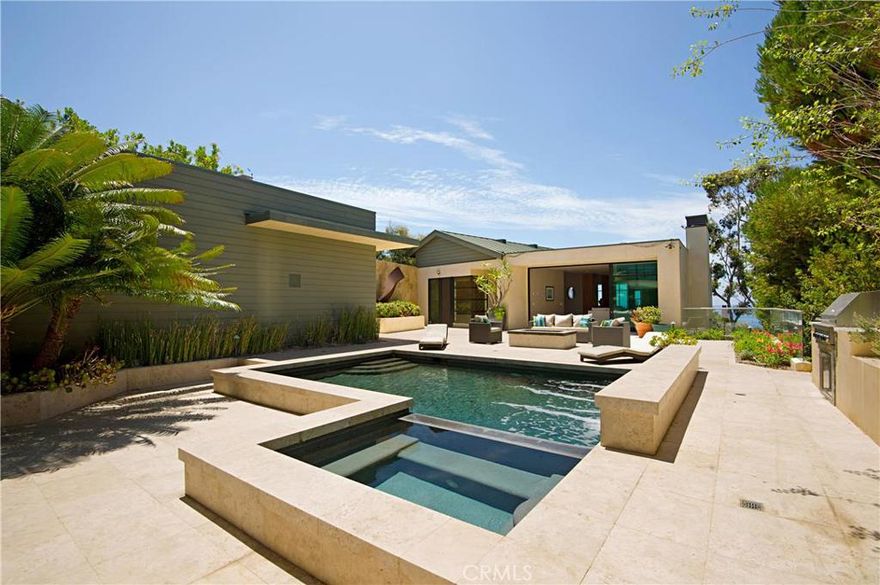 Incredible opportunity to own a "one-owner" "soft-contemporary" custom residence in Laguna Beach! This 4 bedroom/4.5 bath with detached "casita" contemporary-style home has impeccable attention to detail in every corner, topped off with phenomenal Ocean, Catalina, Palos Verdes & coast-line views! Views & sunlight galore from the floor-to-ceiling windows! Formal living room has cozy fireplace and looks out to the pool & spa. Gourmet "chef's" kitchen tastefully done has a large island & is open to the family room, & adjacent wet-bar with wine cooler. Enjoy your morning cup of coffee with an ocean breeze or nice glass of wine watching sunsets on the wrap-around, ocean-facing deck! Large Master Suite has incredible walk-in closet w/ custom built-ins, extra large master bath w/ soak tub and separate shower. Separate "casita" contains 565sqft of space & could easily be used as a guest house, home office, or as a cabana! Sparkling pool w/ waterfall feature, spa, built-in fire pit & built-in barbecue make this outdoor space an entertainer's dream!! Walk out of your yard & down the private path to the gated, locked & private beach path only accessible to you & surrounding owners!! See remarks regarding annual HOA costs.