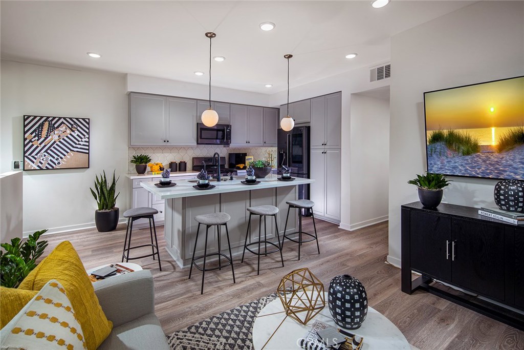 THIS HOME WILL NOT LAST LONG ON THE MARKET!!! Newly built beautiful modern 2 and 3 level Townhomes with 2 bedrooms and 2 to 2.5 bathrooms. Premium features include, upgraded LVP flooring, Quartz Countertop and kitchen full splash, large and generous Milguard windows, EVO (smart home). Walking distance to Target, Khols, banks, and many more retail establishments! Plus, conveniently located near MANY retail shopping locations including Seafood City and 99 Ranch Supermarket, COSTCO, Sams Club, In-N-Out, Chickflia, Ontario Mills, Victoria Garden, many high end resturants, and minutes to Metro Station San Bernadio (brown) line!