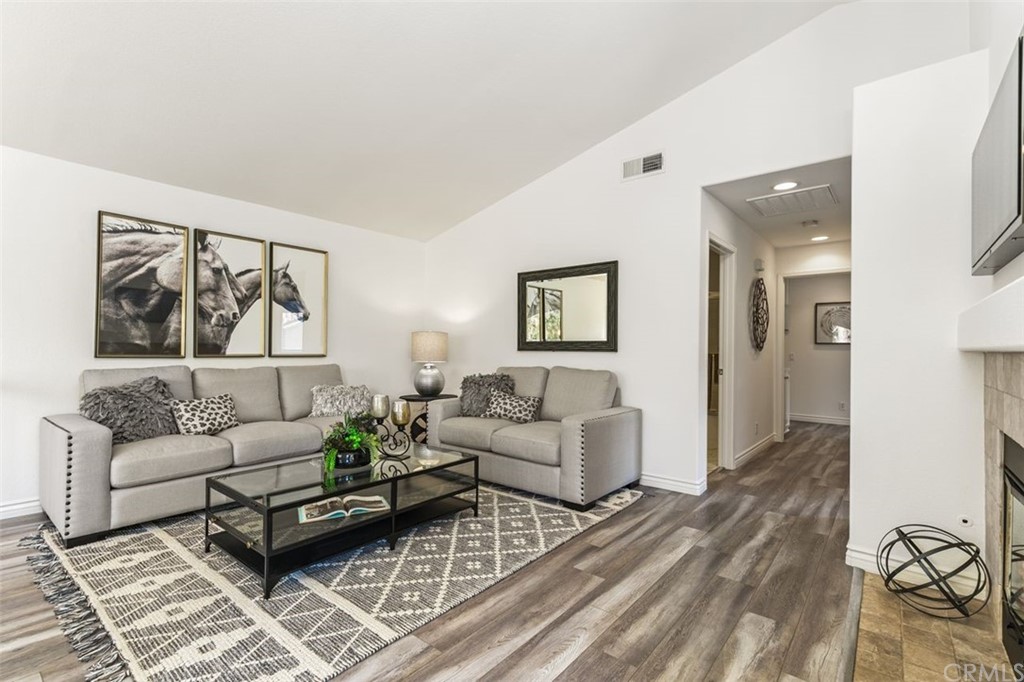Corner End Carriage unit in gated community of Montelena. Welcome home to this desirable plan! Long driveway and direct access garage welcome you to this home that sits up the staircase. Volume ceilings, laminate flooring, private balcony, updated baths and kitchen, lots of storage in the garage and 2 separate closets in the master suite make this unit special . Move right in. Gated community with many amenities, near shopping, schools and entertainment