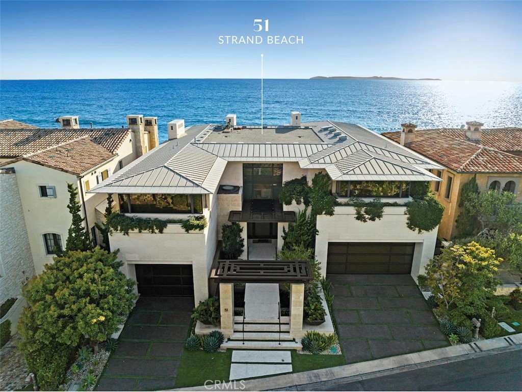 Stunning contemporary custom estate on the oceanfront in the exclusive coastal community of The Strand at the Headlands in Dana Point.