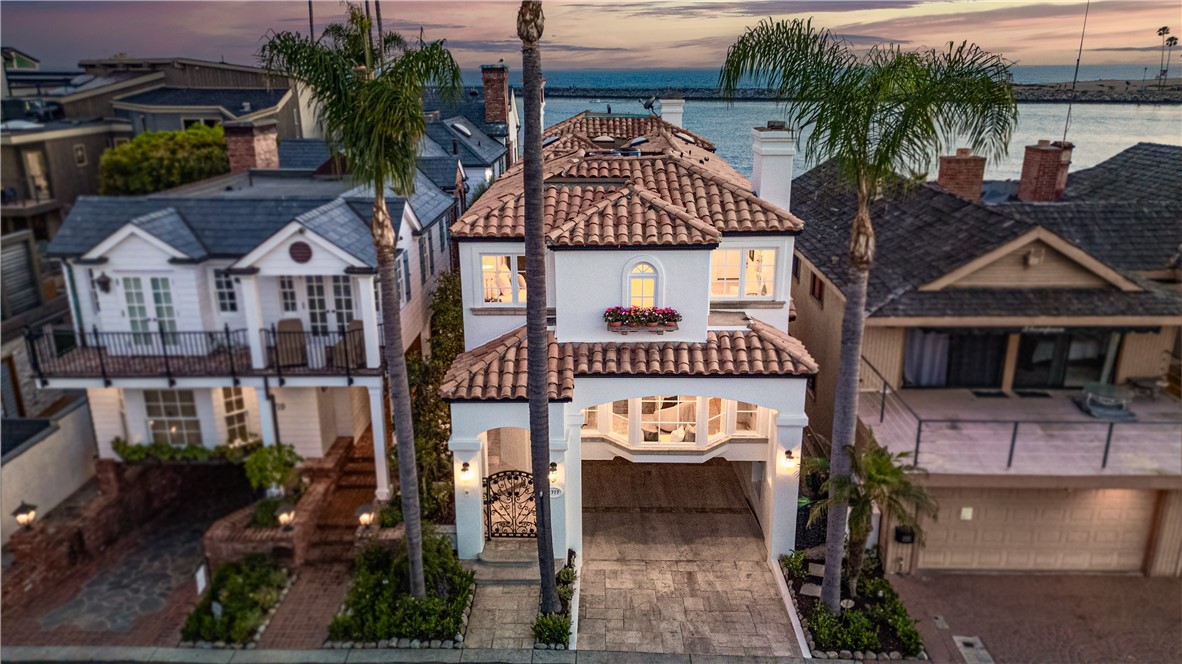 First time back on market since completed remodel on June 16th 2024. Welcome to this beautiful remodeled Mediterranean home with Santa Barbra style overlooking a wide-open ocean view and direct access to the beach. This oceanfront home is truly one of a kind in Corona Del Mar because of the direct access to the sand and up to 8 car parking access. The parking is subject to the size of vehicles but this property has ample parking. Property features include open floorplan with designer touches throughout such as engineered wood flooring, quartzite countertops, custom lighting, fresh interior and exterior paint. The main level includes an entertainer’s kitchen, breakfast room, and living area leading to an open terrace. The primary suite boasts a fireplace, private terrace with China Cove along with Newport Harbor views, and a spa-like bathroom. 3 additional bedrooms located upstairs, one used as an office. Well thought out half bathroom located in the garage for beach days. Short walk to CDM shopping and amenities.