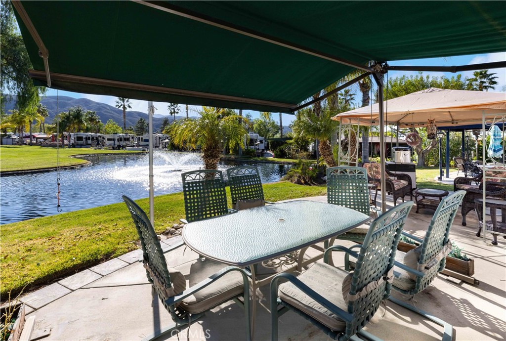 Amazing Waterfront property overlooking the water feature and 3rd hole green of 14 hole golf course. Sit out back under gazebo or your personal electronic awning while listening to the water feature and watch the golfers putt their way to a birdie or par. BBQ Island is conveniently located to take in the views and cook up some hotdogs while entertaining on the patio. Rancho California RV Resort provides amenities such as a 14 hole Executive PAR 3 Golf Course (no fees for owners), 5 Pools/Jacuzzis, Tennis courts, Pickleball courts, Dog park, Club house, hiking trails, Horseshoe lawn and onsite grocery market. The resort is guard gated with no age restrictions. Monthly HOA fee includes unlimited use of the golf course, amenities, trash pickup at lot, water/sewer and common area maintenance. If you are considering a premier Southern California RV destination with convenient access to San Diego, Palm Springs and SoCal beaches, don't miss out on visiting Rancho California RV Resort. **FINANCING AVAILABLE**