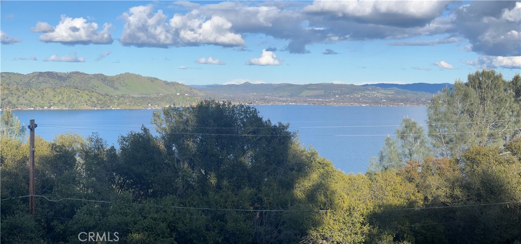 PANORAMIC LAKEVIEWS FROM TWO ADJACENT LOTS downslope running street to street for additional access. Good soils analysis for a standard septic, not a more expensive engineered system. 0.49 acre in total. Easy to do a home with upper level entry off the street and lower level for additional living space. Do one home with good space and privacy around it, or multiple homes. Water and power at the street.