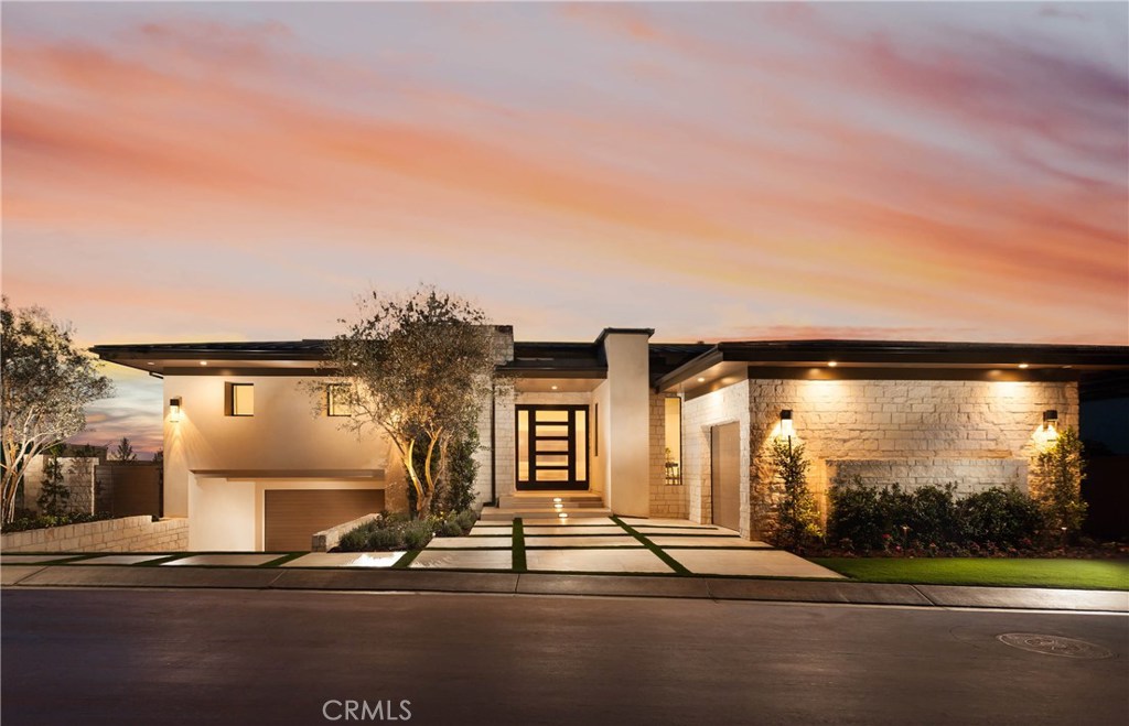 The shimmering Pacific provides a stunning backdrop for preferred ocean-view living at this brand-new custom estate in Dana Point’s guard-gated The Strand at Headlands enclave. The spacious design of approx. 6,306 s.f. lives like a 1-level residence, with a lower level featuring a 3-car garage, game room with pub bar, and large storage room. The main level evokes the feel of an airy gallery, with an open foyer and great room, glass enclosed wine racks, high ceilings, a dedicated home office with fireplace, and views out to the sea. Dine fashionably in a formal dining room that easily accommodates gatherings of 10, or enjoy a casual meal in the breakfast nook, which opens to the impressive kitchen complete with large island, pro-level appliances, a walk-in pantry, buffet, and separate butler’s kitchen. Stairs off the deck lead to a relaxing ocean-view rooftop deck. Four ensuite bedrooms, 4 full baths and 2 powder rooms are displayed, including a phenomenal master suite with ocean views, fireplace, 2 walk-in closets, oversized shower and brilliant skylights. Only the finest finishes, fixtures and materials are featured, with exquisite craftsmanship evident at every turn, and a convenient 4th garage space is included. Grounds boast a pool, spa and loggia.
