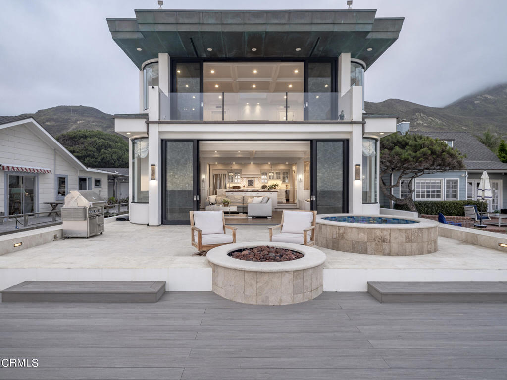 A stunning contemporary oceanfront masterpiece in a highly sought-after stretch of coastline! This sophisticated seaside retreat is situated within the enclave of Solimar Beach Colony with privacy, surf, and panoramic ocean views. With a pedigree that builds from the tradition of clean lines and organic architecture, the four bedroom, three and a half bath home spans nearly 4000 square feet and was designed by well-known Malibu architect, Michael Barsocchini. Barsocchini and his mentor, the legendary Frank Lloyd Wright Jr.'s influence can be seen in every facet of this remarkable residence. The home was originally built for the two-time MLB All-Star, Mike Lieberthal in 2004. Incorporating innovative open floor plans, Barsocchini's designs included dramatic sliding doors and windows to maximize the ocean views, high ceilings, and large skylights.The kitchen, is anchored by two islands adorned with exquisite Statuary Vein marble counters. Every detail has been carefully considered with custom cabinetry, adorned with the delicate Edgar Berebi crystal knobs and handles and high-end appliances from Viking, Dacor and the Mila. The main living area is open-concept coastal living, occupying the entire ocean frontage with a seamless fusion of formal dining, gracious living space, and a focal point fireplace. Towering Fleetwood multi-slide doors, stretching from floor to ceiling, blurring the boundary between indoors and outdoors, while inviting the breathtaking coastal landscape to become an integral part of your living experience. Step outside onto the deck where you will find a renovated inground pebbletec stone lined spa, inground firepit and expansive engineered deckingThe nearly one thousand square foot Primary bedroom seemingly hovers above the coastline, offering an uninterrupted panorama that spans 180 degrees views of the coast. The Primary includes a fireplace, walk-in closets, informal lounging area and a master bathroom boasting a walk-in shower, spa tub and onyx slab counters, walls and floors.