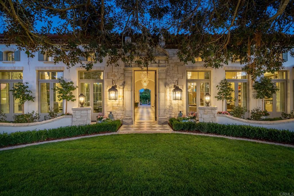~ "CALM" Rancho Santa Fe ~ This new and discrete custom built One-Level Estate is on 5 useable acres spanning two legal Covenant lots of total Peace & Privacy with scenic vistas. The custom floor plan provides an ideal living environment as public rooms open graciously to one another and the main home offers 5+ bedroom suites, beautiful finishes throughout, walls of doors lead out to the incredible gardens & emerald green grass with floating sunning deck, outdoor kitchen with pizza oven, additional outdoor living room off family room too. You will love it! Utopia & the BEST kept secret!