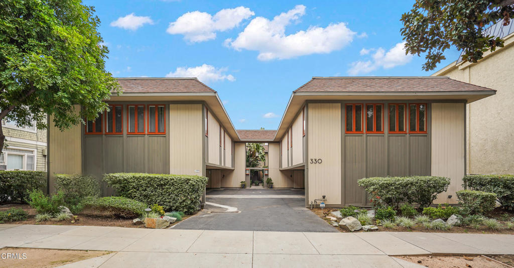 This sophisticated top-floor condominium is located in a stylish Mid-Century complex in the heart of Pasadena. This wonderful unit with abundant natural light, offers incredible privacy and has a great flow. Behind the classic 1960's wide front door is a welcoming formal entry. The expansive and airy living room with recessed lighting has a charming, tiled fireplace. In addition, there are wall to wall windows and sliding glass doors that open to a large, spacious balcony. The adjoining dining room also has large windows and opens directly to the stunning updated kitchen. The kitchen features elegant tile, granite countertops, recessed lighting and updated cabinetry with lots of storage. Down the hall is the spacious primary suite with wall-to-wall closets and a beautifully updated full bathroom. There is a second good-sized bedroom, currently being used as an office, plus a three-quarter bathroom off the hall. Conveniently located inside the unit is a stackable washer and dryer. The HOA recently retrofitted the soft-story portion of the building for earthquake safety. This fantastic home is perfectly situated near South Lake Avenue, the Paseo and Old Town Pasadena and it offers an ideal combination of comfort, style and serenity. Welcome home!
