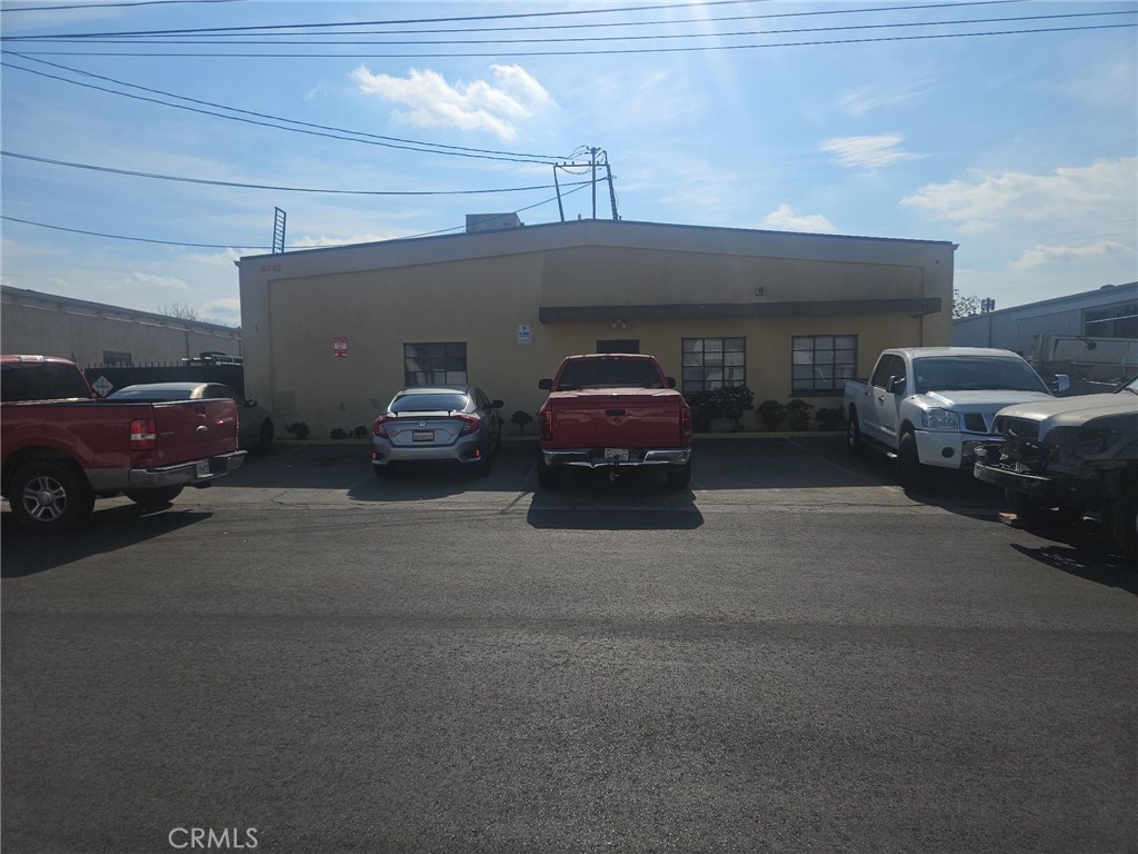 This light manufacturing facility features a single-story warehouse with a dedicated office space at the front. The office area includes two private offices and a bathroom, providing a comfortable and functional space for administrative tasks. The expansive warehouse area is supported by two additional bathrooms, and a bonus room in the rear.