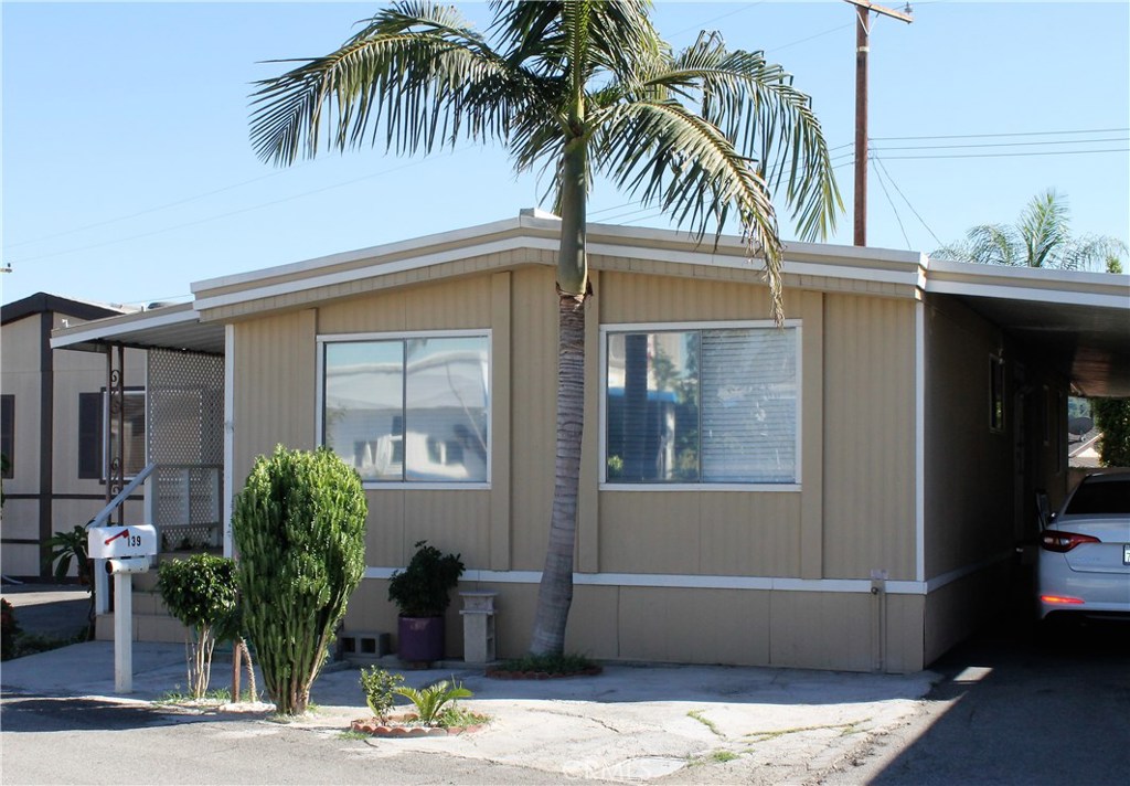 Beautiful 2 bedroom 2 bath manufactured home located in the quiet community of View Park Mobile Estates. Built in 1976, this home features laminate flooring, recently painted inside and out, an inviting porch, spacious kitchen and dining room that opens into the living room. Master bedroom with built-in cabinets and attached en suite. Second bedroom features an attached bonus room with access to the backyard. Indoor laundry area with access to the carport that has parking for 3 cars, possibly 4; backyard with storage unit. This home is located in a family and pet friendly park.