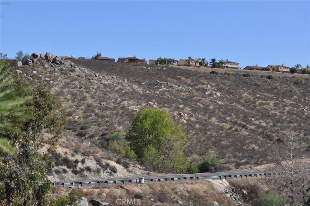 Priced to sell. 17.46 acres on La Sierra Ave. Approximately 2,000 feet of frontage on La Sierra. Zoned R-A-5. Possible 3 view lots. Use your imagination and you can have 2-3 nice homesites with wonderful views for a low price. Buyer to do all due diligence to satisfy themselves. Great price for size of property. Great location among the homes of Lake Hills. Property consists of 2 adjoining parcels.
