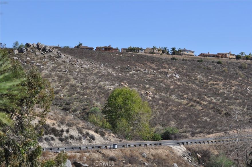 Priced to sell. 17.46 acres on La Sierra Ave.  Approximately 2,000 feet of frontage on La Sierra.  Zoned R-A-5.  Possible 3 view lots.  Use your imagination and you can have  2-3 nice homesites with wonderful views for a low price.  Buyer to do all due diligence to satisfy themselves.  Great price for size of property.  Great location among the homes of Lake Hills.  Property consists of 2 adjoining parcels.