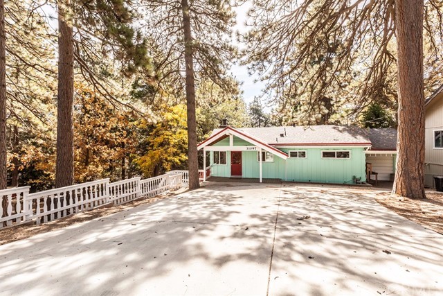 Adorable Mountain Home with extra lot, 2 fireplaces and basement level. Must see to appreciate. Level entry with ample parking.