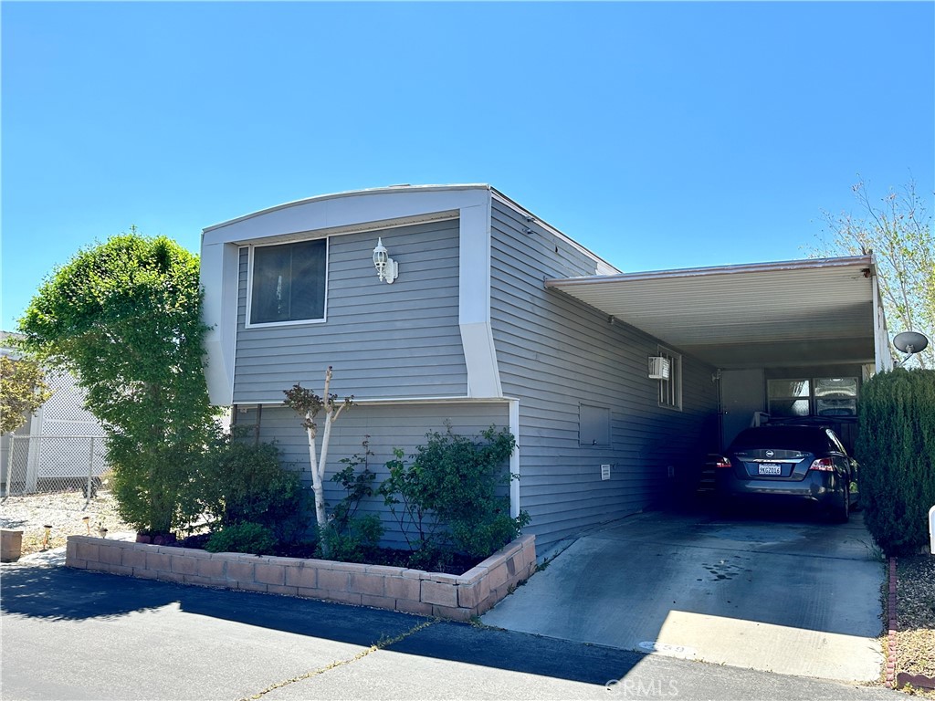 New improved price!!! Embrace Active Senior Living in Victorville!!! Downsize to luxury, not lifestyle! This captivating 2-bedroom, 2-bathroom mobile home in a vibrant 55+ gated community offers the perfect blend of tranquility and social connection. The next lucky buyer gets a rare find with this home. Its not often you find a home like this with a raised Kitchen and dining area. Not only does this provide a unique view overlooking the living room and outside but it also adds an expanded storage area. Imagine Relaxing mornings in your private yard, enjoying the quiet location, Inviting friends for an afternoon by the sparkling community pool, Challenging neighbors to a friendly match on the tennis courts, all within easy reach. This active community is close to everything you need. Explore nearby shops, restaurants, and entertainment options, all conveniently located. Enjoy the freedom of a commuter-friendly location. Plus, this charming mobile home boasts affordability, with ownership opportunities that free you from renting! Don't settle for an apartment - own your own piece of paradise! This beautiful home offers a private yard, a community pool, tennis courts, and an active social scene, all at an incredible value.