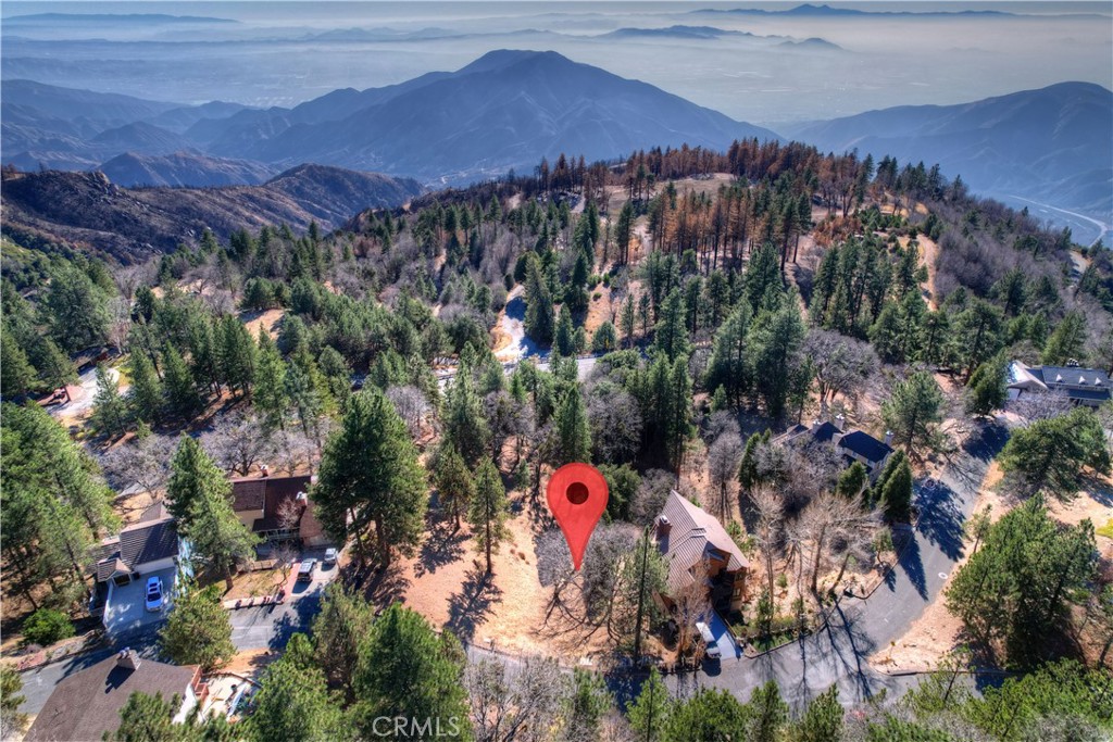Build Your Dream Home in the Enchanted Forest! Discover an incredible opportunity to create your perfect mountain retreat in the coveted Enchanted Forest neighborhood of Running Springs! Nestled just upslope of Highway 330, this stunning lot offers the breathtaking views you’ve always dreamed of. Running Springs is a charming mountain community, loved by skiers and those seeking a cool escape from the summer heat. Its convenient location makes it an easy trip from many SoCal neighborhoods, offering the perfect balance of seclusion and accessibility. Surrounded by stunning homes in a sought-after area, this lot is the ideal canvas to design a one-of-a-kind mountain sanctuary. Whether you’re looking for a year-round residence or a weekend getaway, this is your chance to bring your vision to life in a neighborhood that truly lives up to its enchanting name. Don’t let this rare opportunity slip away—contact us today to learn more!