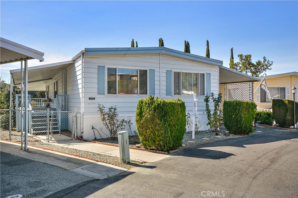 If your looking for a great quiet place to retire to and live in a beautiful mobile home park ages 55+ with a great view of the golf course and a huge wrap around deck then your search is over. Located in Desirable Heritage Park. This house also has a nice ramp from carport side for those needing extra help .Close to everything. The promenade mall is right up the street. The movie Theater is also at the mall. Wonderful wineries are minutes away!! Pechanga casino is 10 minutes away and all the great Restaurants are very close too. Brand new neutral carpeting in the 3 bedrooms and living room. Interior was just professionally painted. There is no HOA you just pay space rent its approx. $819 plus about another $50 per month for water, trash and sewer. Your utility bills are very low and no property taxes. Buyer needs to get park approval before buying. 55' long by 24' wide. Just sales tax one time fee at closing and register mobile home every year.low cost. There are lenders for these mobile homes. Please inquire for info.