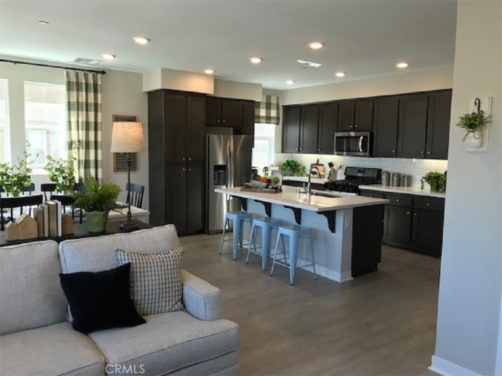 TOVARA West is a Beautiful Gated Community of 125 Brand new Tri-level Townhomes in the heart of Sylmar. This homes features 1285 sqft of open living space two bedrooms, 2.5 baths and attached OVERSIZED 2 car garage. A Stunning kitchens with Beautiful Smoke stain cabinets, Quartz counter tops, All Kitchen Stainless steel appliances including the Refrig, Washer/Dryer and upgraded laminate flooring. Tankless water heater and great energy saving features. Our community has a private tot lot, and a pool, dog park, guest parking. We are close to shopping, restaurants, and access to 210, 118 fwy and close to the 14 fwy, 5 fwy and the 2 fwy. Its perfect for anyone who commutes. Easy bus stop access as well. Close to Hansen Dam aquatic center, golf, the Discovery cube of Los Angeles. All Photos are of a decorated models.