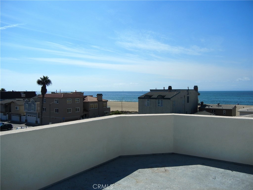 New townhouse stones throw to the beach, lease this turnkey property with amazing ocean views is available. Spacious four - level house with two car garage on first level with two bedrooms / two baths on the middle level, kitchen with living room & dining area on third level with roof top deck on the forth level. Approximately 1653 sq. ft. of living space with an additional 678 sq. ft. roof top deck does not come a long very often. If your looking for a classy place to live in a great location then come see it! Across the street from Peters Landing walking distance to Starbucks you will love living across the street from the beach. One of Sunsets Beach's newest properties for lease!