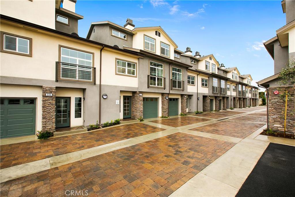 Builder Close-out! Huge price deduction! Beautiful brand new townhome located in the GATED Seabright community in Costa Mesa. Great location near Triangle Square; only 2.5 miles from the beach. Spacious 1,643 sq.ft home with 2 beds, 2.5 baths, 2 car attached garage with private balcony and REAR YARD.
This homes features maple portillo cabinets, GE stainless steel appliances, incl. Stove, microwave and dishwasher; granite countertops (Santa Cecilia) with full backsplash at kitchen; 9 foot ceilings, structured wiring system with RG6 Cable and CAT5 Phone wiring for state of the art communication and networking, pre-wired for ceiling fan in all bedrooms, upgraded flooring with laminate wood at entry, kitchen, living/dining room, upgraded 12"x24" tile in master bath and bathroom 2... Value of included upgrades is $16,700. Home is ready for quick move in.
Pictures shown are of the model and are for illustrative only.