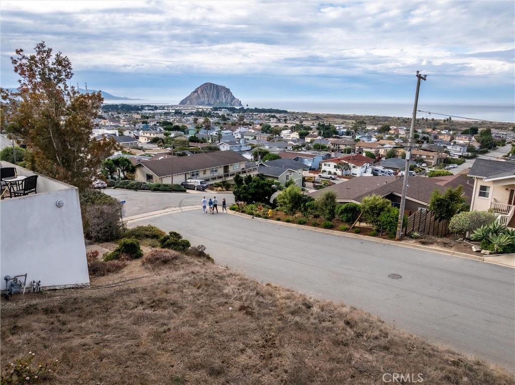 Imagine waking up to these incredible views every day when you build your dream house on this large 6200 Square foot Lot. The Panoramic Unblockable views of the Ocean and Morro Rock will make this your happy place. Please see sample permit fee schedule in supplements. There is a Coastal Development Permit in place - issued 12/8/23 and it expires on 12/8/25. (Extension is available) Please contact the City of Morro Bay Building Dept for questions regarding the permit & building process.