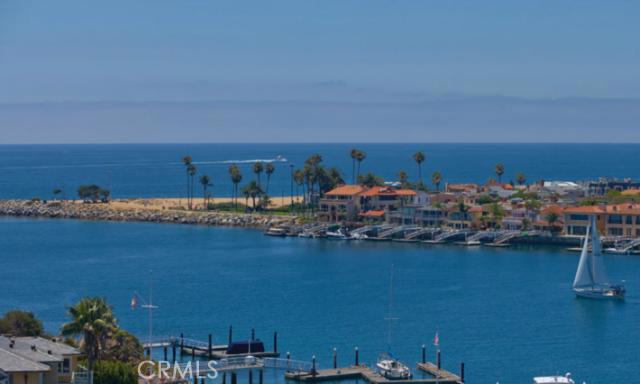 Breathtaking ocean and Catalina Island views throughout this Transitional, European inspired home located in a quiet enclave of selected homes overlooking Newport Harbor. This Corona del Mar residence provides approximately 4,500 square feet of relaxed living space, featuring 4 bedrooms and 5 ½ bathrooms. Upon entering, you are immediately enveloped by thoughtful luxury with herringbone wood flooring, Venetian plaster walls, hand crafted millwork and antique fixtures framing your eye to unobstructed panoramic views. No detail overlooked or expense spared with visual treats grabbing your attention and drawing you into the comfort of this superb residence. The master suite replete with his and her bathrooms, the use of rare stone, custom lighting and antique finishes is the height of refinement. State of the art audio, video and lighting systems complete this one of a kind residence.
