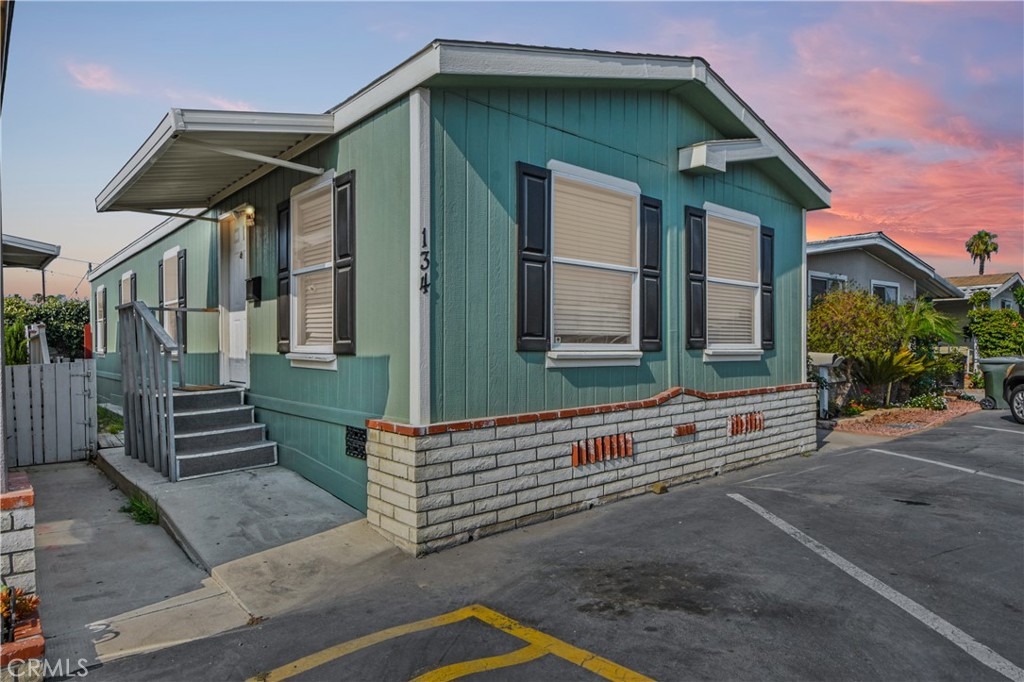 Welcome to Golden Skies Mobile Home Park! This Beautiful 2000year Spacious Home is nestled in a Family Park with Convenient access to all amenities, shopping entertainment such as Disneyland, Angels Stadium and the Anaheim Packing House. If you like the Modern Look, you will enjoy the touches this newer mobile home has to offer. It's a double wide year2000 Champion with 3 bedroom and 2 full bathrooms, a rare find in this community with 2 assigned front parking spots. Do not miss the individual laundry room with side by side hook ups, newer flooring, upgraded dual pane windows, new interior paint and a large Master Bedroom and Bathroom. All Appliances Included/Washer/Dryer/Fridge! For entertainment, this home offers a huge backyard patio with fresh recently poured concrete slab! Don't Miss out on the opportunity to live in one of the best homes this community has to offer!