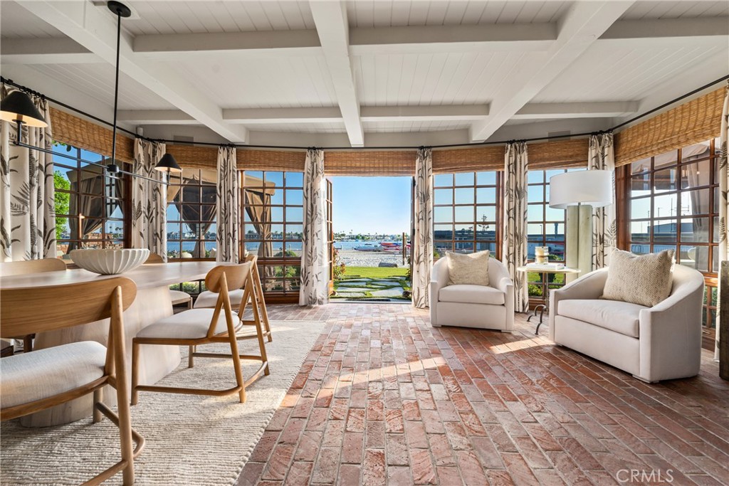 Welcome to your dream waterfront property, an iconic residence on picturesque and private Mother's Beach designed by famed architect Brion Jeanette. This stunning Newport Beach home offers 4,707 square feet of luxurious living space on an expansive lot measuring 7,560 square feet. Enjoy breathtaking views of the harbor entrance, ocean, and Catalina Island from the comfort of your home, or enjoy front-row seats for the Christmas Boat Parade.
This exquisite estate features four bedrooms and 4.5 baths, with one bedroom conveniently converted into a functional laundry/office space. The home boasts beautiful wood floors and charming beamed ceilings, adding character and warmth to each room. The chef's kitchen is a culinary haven with granite countertops, a Wolf range, and a Sub-Zero refrigerator to inspire your gourmet creations. A third-story office offers a private retreat with panoramic views that will leave you in awe.
There is no shortage of entertainment space in the oversized great room or the spacious upstairs bonus room, complete with built-in cabinetry and a wet bar. You can also take the party outside to the back patio and lawn leading up to the sand. The backyard provides two fireplaces and a built-in BBQ.
The property also includes an oversized 3-car garage with lots of storage space, and the driveway provides an additional four cars of on-property parking. Don't miss the opportunity to own this rarely offered beach and bayfront home, where every detail has been designed to offer unparalleled luxury and comfort.