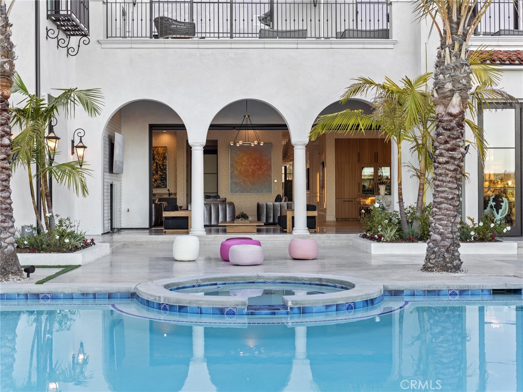 Beyond the coveted second gates of Crystal Cove, where sweeping canyon & ocean views create a spectacular backdrop, this 9,906 s.f +/- residence goes beyond perfection, to the sublime. With 6-beds, 9-baths, it's an investment in the art of bespoke design; every surface has been obsessively planned and exquisitely executed. Staggeringly beautiful living spaces flow throughout a sprawling main floor, with multi-slide doors seamlessly connecting to nature. A wall of black marble is a moody contrast to crisp white ceilings in the living room, multiple dining areas and a caterer's kitchen create unforgettable entertaining, and an airy family room links to a sumptuous kitchen with stunning finishes and top-of-the-line appliances. Lit by a modern teardrop chandelier, a subtly curved staircase leads to an upper floor with bedrooms that feature enchanting touches: artful lighting, stone fireplaces, walls of glass with stunning views, wallpapers with sophisticated whimsy, and gorgeous ensuites. The primary bedroom is an enviable space featuring to-die-for dual closets, and a spa-like bath swathed in marble. The 28,000 s.f. +/- lot is filled with places to unwind: a refreshing pool, 773 s.f. +/- of loggias, BBQ kitchen and a cabana with ocean views. Additional features include a 534-bottle wine cellar, private office, guest & 5-car garage. Crystal Cove is a pristine 24hr guard-gated community with a residents-only Canyon Club, and easy access to shopping, dining & beaches. (Note: one bedroom is presently being used as a media room.)