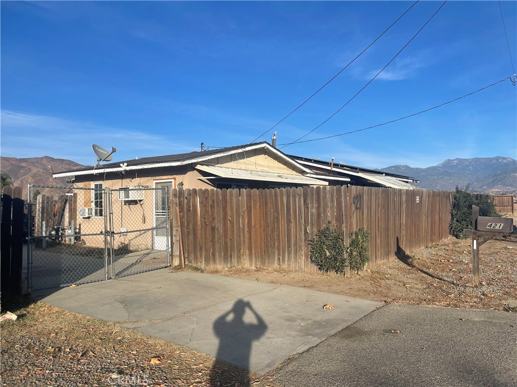 Great investment and income producing opportunity on a ±1.5 Acres lot. The duplex consists of one unit with 3 bedrooms and 3 bathrooms and the second unit with 2 bedrooms and 1 bathroom and a car garage. There are two separate entrances to the back and each unit have their own address and driveway. The entire property was fully fenced and has an newer roof, new sewer system connected to public line, solar panels. Perfect location! There is a walmart across the street, close proximity to Shopping Centers, Public Transportation, Gas Station, Movie Theater, and Restaurants.