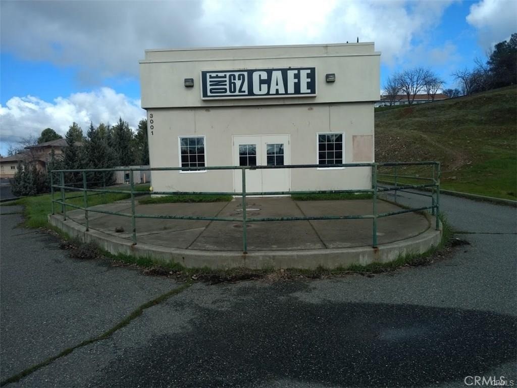 Prime commercial opportunity onButte County Bussiest street. This versatile building sits on over half an acre, offering plenty of potential—including space for a plaza with some excavation. Formerly a café, it features a drive-through window, dining area, two bathrooms, and a large storage space. Equipped with three commercial refrigerators, a freezer, a fresh vegetable cooler, a pastry warmer, two commercial ovens, tables, chairs, and other kitchen essentials, it's move-in ready for a restaurant or other business. With high visibility and ample space, this is an excellent investment for one or multiple businesses!