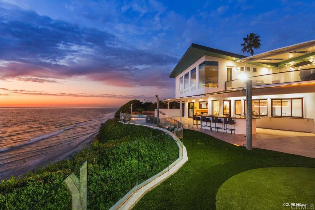 *Exclusive Beachfront Estate* Prominently positioned for maximized panoramic coastal views from virtually every room. This spacious home sprawls upon a rare double lot which provides extensive privacy & unparalleled 100 ft. ocean frontage. *Modernized Encinitas Estate* Constructed w/extreme safety-conscious foresight & was built w/40' distance from the Bluffs edge, atop 29 concrete Caissons. Construction expense was not spared. Designed w/Structural Steel & Wood Framing. Located in the "Heart of Encinitas". D St. Beach access just steps away. Moonlight Beach, kid-friendly grass Park & Downtown Shopping District a block away. This residence offers every amenity imaginable. Culinary Gourmet Kitchen w/Butler Pantry, top-of-the-line Appliances & Thermador Gas Cooktop. Electric Window Coverings, Lutron Grafik T Lighting System & Surround Sound throughout. 4 Gas Fire Places. Double La Cantina Door's open to the Backyard which includes 2 Covered Patios one with a spa, Self-Contained Cooking Station, Gas Fire Pit, Golf Putting Green, Double Sliding Electric Security Gates.Come relax and enjoy gorgeous sunsets and listen to the soothing tranquility of crashing waves.