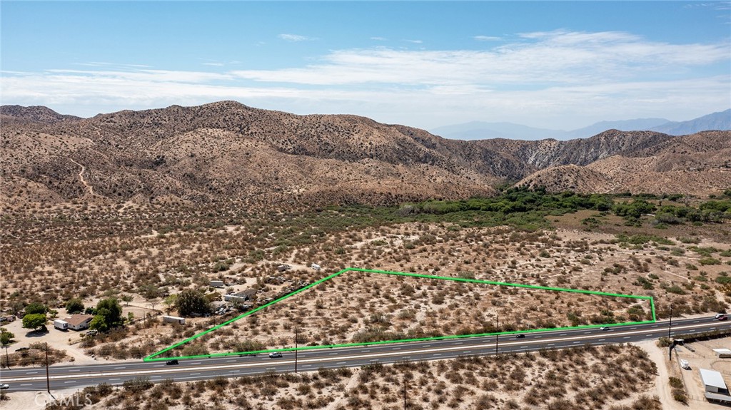 6+ Acres of Highway Front property in central Morongo Valley. Utilities are adjacent or near property (buyer to check). Located on east side of highway, with the Morongo Preserve tucked up against the hillside, offering lush vegetation. Zoned residential. Official County address has already been assigned!