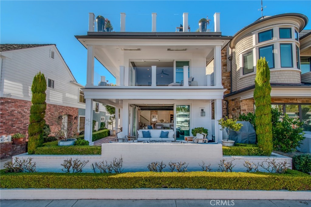 Welcome to 317 E. Bayfront where a rare opportunity awaits; undoubtedly the most superb property on the iconic Little Balboa Island! This pristine WATERFRONT home was custom-built in 2019. Included is a newly built private dock able to accommodate a +/-50 foot boat accompanied by a side-tie for a Duffy Boat. The high-end custom interior design is luxuriously detailed with a fresh, coastal aesthetic. The 3 spacious levels include a Bonus Room that opens to a Rooftop Deck that entertains a spacious lounge w/Firepit, Spa, Wet Bar and Dining area. The Living Room opens entirely by modern stacking glass doors onto an Outdoor Lounge area that embraces a gorgeous waterfront view and first-class coastal living. The Elevator offers an effortless transition from floors 1-3. For children and guests, you cannot resist the charm and luxe of the “Bunk Room” in the secondary bedroom. The Primary Bedroom opens expansively with stacking glass doors to a covered deck retreat. Wide-plank wood floors and fine custom millwork run throughout. The ceilings are richly appointed with custom oak wood beams. The bathrooms are appointed with marble slab countertops and the finest designer lighting and plumbing fixtures. The gourmet kitchen boasts a pristine butler's pantry for added convenience and a spacious dining area with a custom built-in banquette. There are countless details to appreciate throughout this impeccably done property.....it is a unique and luxurious turnkey opportunity....a must see!!!!