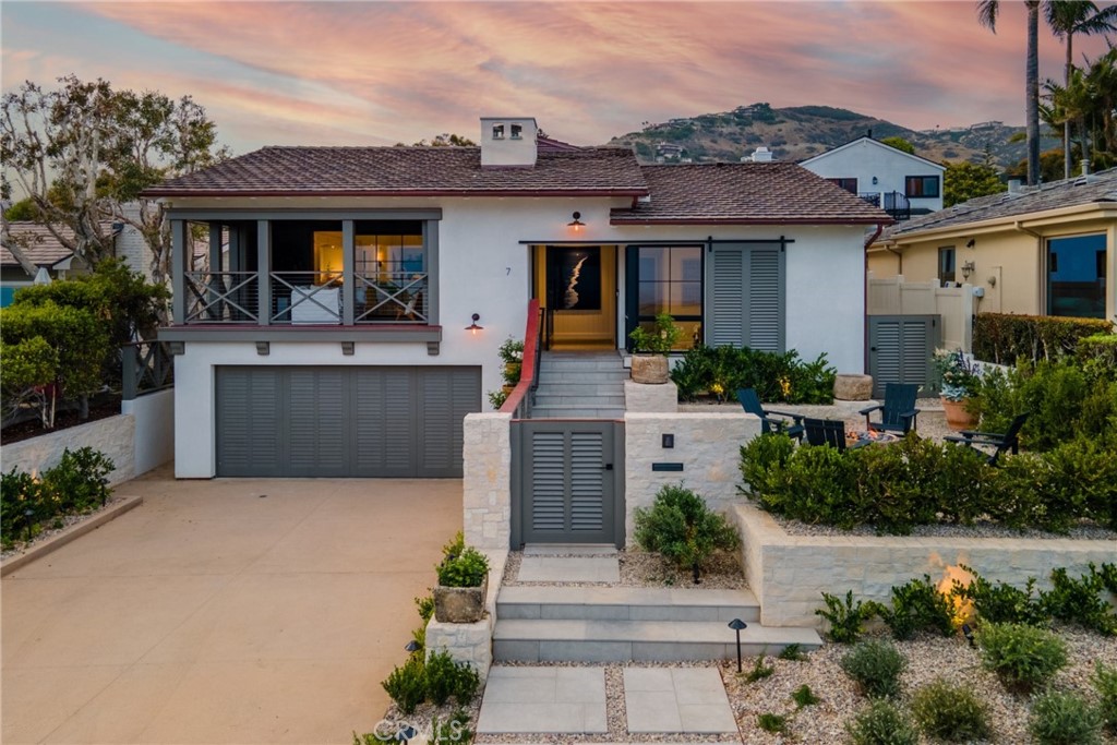 Impeccable, chic, and set near the beach, this is a rare opportunity to secure a newly rebuilt home in the sought-after community of lower Three Arch Bay. A project 3+ years in the making, this incredible custom residence has luxurious finishes and on-trend features, from the exposed-beam vaulted ceilings to the custom white oak woodwork and Warren Christopher European flooring throughout. A basalt stone fireplace lends warmth to the open living room and dining area where glass sliders allow a seamless indoor/outdoor flow. In your high-end kitchen, you’ll have bespoke cabinetry, Sub Zero Refrigerator, Wolf 48’ Gourmet Range, and an oversized Calacatta marble-topped island. An expansive covered porch is ideal for enjoying spectacular, truly mesmerizing ocean views. Escape to your secluded retreats, all fitted with ensuite baths. Surpassing all in size, the primary suite has a large walk-in closet, plus an ensuite featuring dual vanities and a shower with bench seating. Outside, weekend BBQs are bliss in the backyard overlooking the private, in-ground pool surrounded by beautifully landscaped hedges and fruitless olive trees. Noteworthy items include HVAC, pre-wiring for surround sound, quick beach access, community amenities that make this neighborhood one of Southern California's favorites. This home is where casual comfort meets coastal luxury and class. A true beach home in every sense and a very rare coastal real estate offering. Come take a tour while the opportunity lasts!