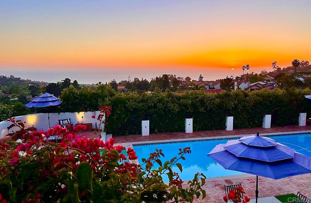 The ultimate in discretion, luxury and panoramic views. Set on a sunny, elevated lot at the top of the coveted La Jolla Muirlands, this gated Mediterranean estate is 10000 square feet of ocean breezes and 180-degree ocean views. This beauty radiates warm coastal elegance. A discreet gated driveway leads into a large courtyard with towering palms, a three-car garage, and grand entrance door against a backdrop of bright white stucco with deep blue detailing. At once perfect for both family life and large-scale entertaining, this home provides six large, well-appointed bedrooms each with en-suite baths and large wardrobes, a classic and timeless office with full built-ins, coffered ceilings, and conference area, a fully-equipped gymnasium, sauna, eat-in kitchen, formal dining room, and two living rooms, with ocean views from nearly every room. Outside, enjoy the large flat yard, enormous pool and attached spa. Multiple entertaining patios fully equipped with commercial-grade catering equipment, multiple bars, and built-in seating islands make family and corporate gatherings a breeze and are the perfect spot to watch resplendent sunsets over the whole horizon. Buyer to verify all before COE.