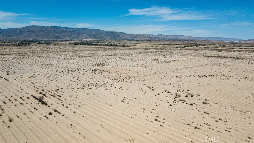 Discover an incredible opportunity with this 40-acre parcel nestled within the vibrant city of Twentynine Palms. This expansive property offers a blend of natural beauty, strategic location, and essential utilities nearby, making it an ideal canvas for your vision.



The parcel includes a deeded interest in two wells located just to the east on the adjacent 10-acre parcel. While the condition of these wells is currently unknown, they offer potential additional water resources. For your convenience, there are water lines at the road available on the southwest corner of Indian Trail and Sherman Hoyt, providing essential infrastructure for development or agricultural use. Electricity is approximately 660 feet from the property, facilitating the installation of power for various uses.



Situated in Twentynine Palms, this property benefits from close proximity to the city's amenities, including shops, restaurants, and cultural attractions. Its expansive size allows for a range of possibilities, from residential development to agricultural projects or recreational ventures. The surrounding desert landscape offers stunning views, peace, and a unique connection to the natural beauty of the Mojave Desert.



This 40-acre parcel presents a rare chance to own a substantial piece of land with vital utilities close at hand in a growing and dynamic community. Whether you are looking to build a private retreat, invest in land, or embark on a new venture, this property provides the perfect foundation for your aspirations. Don't miss out on this exceptional opportunity to secure your place in the heart of Twentynine Palms. 

Buyer to do all due diligence and investigations regarding the property