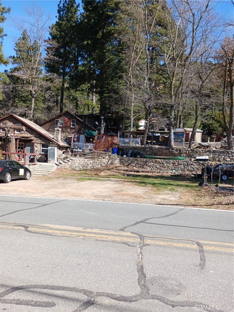 Can you believe it - these are flat lots in Crestline. There are 2 full lots and 1/2 lot included in this parcel. The frontage is 63 feet and runs back from street 101 feet. There is a driveway access on the right leading to the houses behind this parcel. It is located across from storage units. Check it out today.