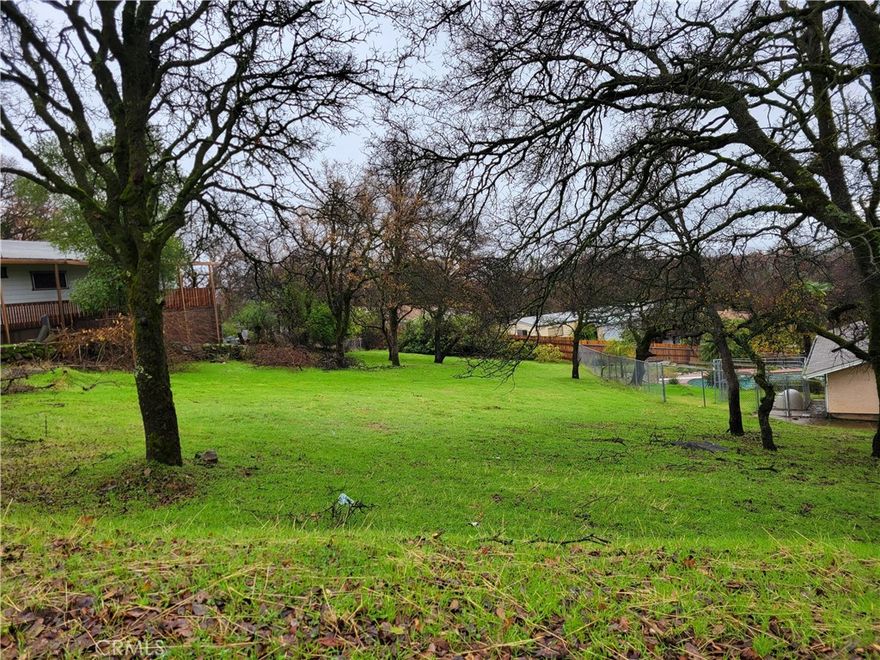 Priced right! This quarter-acre parcel is a nice place to start a new beginning—a blank canvas to Build to suit or place a new manufactured home. This lot sits back from the street to allow privacy from the cars driving by. Kelly Ridge is a lovely community, next to the Oroville Visitor Center with lots of Hiking, biking and equestrian trails: the Bidwell Marina and Campgrounds and of course Oroville Lake! There is a ton of recreation to be experienced.

Check out the home next door that is also listed for sale. Call today for details.