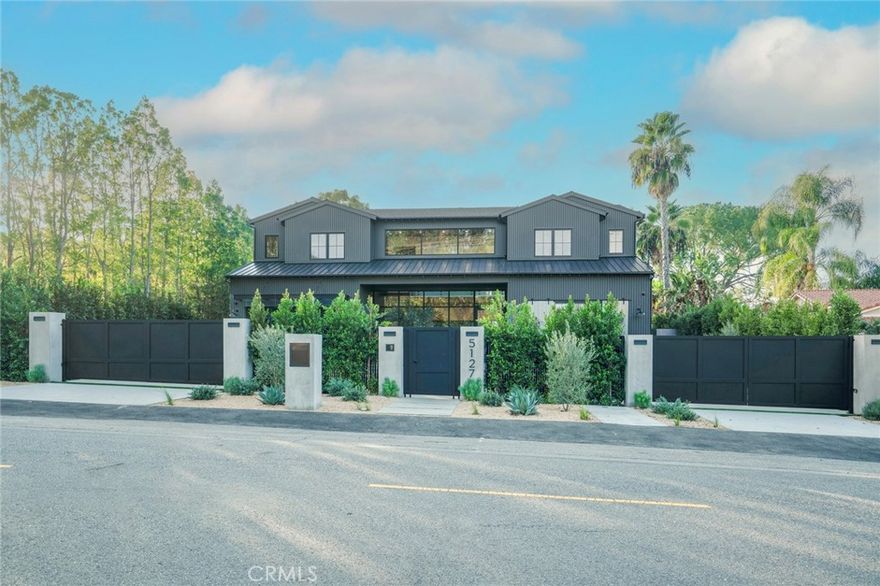 Welcome to the most exquisite New Construction home in the neighborhood. This house features every little luxury detail. This stunner was built and designed with the best finishes in mind. Exterior of the house is designed with combinations of dark colors and lots of glass throughout. Property features a gated circular driveway leading to a 50 foot long RV/ motorhome parking space with sewer hookup. Walking in you'll feel the warmth of this house immediately. Open floor plan throughout and yet so cozy. First floor features one bedroom with a full bath, powder room, office with steel glass doors and a spacious theater. kitchen open to the Family room and outside which creates the perfect entertaining atmosphere. Kitchen features custom cabinetry, quartz countertops, high end Thermador appliances including a large wine fridge, two sinks, walk-in pantry with space for a second refrigerator and much more. Wet bar with a sink, ice maker and beverage fridge located in the best spot of the house. Second floor features four en-suite bedrooms and a large master suite. The master has a balcony,  his and hers walk-in closets with a large bathroom with double sinks, soak-in tub,  large walk-in shower and  a makeup desk area. Hallway opened to a bonus loft TV room along with a large balcony to enjoy those summer nights. Moving to the outside you'll find the perfect entertainer's backyard. Green yard with Heated pool and spa, outdoor kitchen, open cabana with fireplace and speakers, large sports court for pickleball and basketball and lots of sitting area. Outdoor also features a 920 sqft ADU which has a full kitchen, one bedroom, one bathroom and a large living room open to the backyard for the ultimate entertaining. This home is a must see!