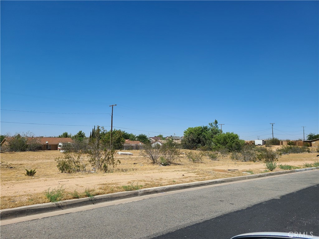 One of three adjacent 9,375 sf lots for sale in Victorville. Can be purchased separate or all together. This listing is for Tract No 7636, Green Tree North No 1 Lot 8. MDR zone (mixed density residential) with highest and best use for Duplex's. The area is bounded by Puesta del Sol Drive to the north, Tawney Ridge Lane to the east and south, and Green Hill Drive to the west. The neighborhood consists mostly of single family dwellings and is within proximity to the 15 Freeway, Horseshoe Lake, Spring Valley Lake, a Golf Course, entertainment, shopping, parks, schools, restaurants, etc. Dimensions: 75X125