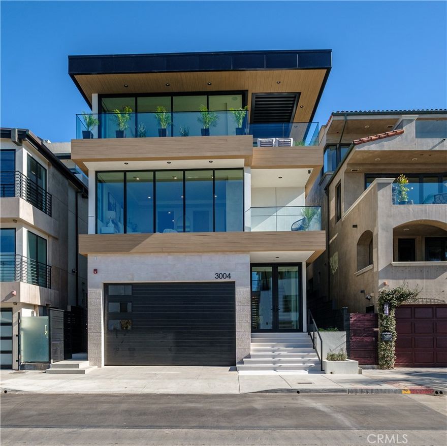 Exquisite New Build in the Heart of Manhattan Beach's Sand Section

Experience luxury beach living at its finest in this spectacular, newly constructed single-family home by JW Powers. Located steps from The Strand, this stunning residence offers unparalleled 180-degree ocean views that make it a standout choice for discerning homebuyers.

This thoughtfully designed home features a below-grade Jr. ADU, perfect as a media room or an income-generating rental. As you step inside, the entry-level boasts a welcoming open space, a bedroom, a full bathroom, and a convenient laundry room.

Take the custom open staircase or elevator to the bedroom level, where you’ll find the serene ocean-view primary suite, complete with dual closets, a cozy fireplace, and breathtaking coastal vistas. This level also includes two additional bedrooms, ideal for family or guests.

The top level is a showstopper, featuring an expansive great room, a custom gourmet kitchen with high-end appliances, a walk-in pantry, and a large center island. Fleetwood doors seamlessly connect the interior to the spacious deck, perfect for dining al fresco or lounging while soaking in the panoramic ocean views.

This exceptional custom home combines elegance, functionality, and location, creating the ultimate coastal retreat. Don’t miss the chance to make this one-of-a-kind property yours—it’s sure to impress and won’t stay on the market for long!
