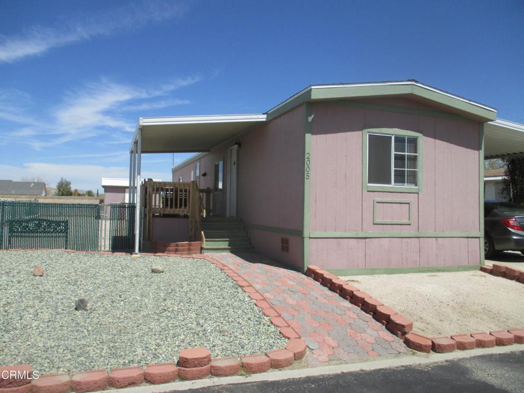 Welcome to your next home in the gated community of Desert Rose Estates. An affordable home on a large lot. A newer roof. 2 bedrooms, 2 full baths, laundry room, dining room and a deck to enjoy those beautiful summer evenings. The complex features a lovely clubhouse, pool and spa. At this price it will not last long.
