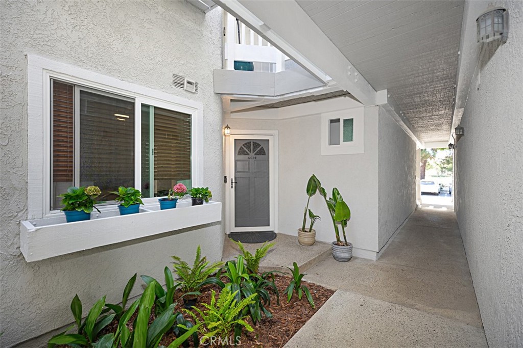 Stunning END unit in the coveted Pointe Surfside community in Huntington Beach. One mile from the beach and the walking trails at the Bolsa Chica Wetlands! This highly upgraded home offers 3 bedrooms, 2 full baths, TWO spacious decks and many beautiful upgrades. From the moment you walk in, you will be impressed with the open floor plan, abundance of natural light, and south facing sea breezes. Impressive upgrades include: new dual pane energy efficient windows and sliders, LVT floors, recessed LED lighting, Ring security camera, high end security screen with locking door and freshly painted throughout. Perfect for the gourmet cook, the renovated kitchen includes new stainless steel appliances:refrigerator, dishwasher, microwave, and top of the line dual range oven with 5 burners and air fry feature. Sparkling quartz countertops, and freshly painted cabinets and hardware throughout. The kitchen flows effortlessly into the entertainer's delight living space which has an exquisite gas fireplace adorned with designer glass. The family room opens to a spacious wrap around deck with plenty of storage. It is the perfect place to BBQ and enjoy the salty air. The primary bedroom retreat has a charming window nook, en suite bathroom and custom closet with wood panel doors. The secondary bedroom could serve as another primary suite with its own private deck. The third bedroom could be utilized as a home office or yoga retreat.
The dual gated community has serene water features and streams throughout, a newly resurfaced pool and spa, two lit tennis courts, clubhouse and ample guest parking. Ideally located in walking distance to the Bolsa Chica Wetlands, beach, shops and restaurants in the nearby Huntington Harbour center. This home truly encompasses the SoCal lifestyle. Don't miss this opportunity to make this amazing home your own!