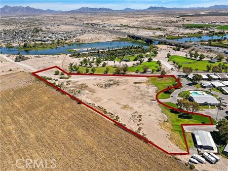 Exceptional Land with Water Rights in Blythe - Endless Potential! Discover a rare opportunity in the heart of Blythe! This extensive piece of land offers generous space and valuable water rights, making it a true find in the desert landscape. Presently zoned as commercial, its versatility extends beyond imagination, as the city is open to a number of different rezoning options to match your vision and needs. Key Features: Over 5 acres of sprawling of flat, pristine land, providing a blank canvas for your endeavors. Valuable water rights ensuring a consistent and reliable water supply for your projects. Commercial zoning in place, showcasing its potential for business, trade, and development. Potential for rezoning, allowing various alternative uses like residential, agricultural, recreational, or mixed-use development. Convenient road access to the I-10 freeway, ensuring easy connectivity to major routes and amenities. Breathtaking views of the surrounding natural beauty and stunning desert landscapes. Investment Highlights: A property primed for growth and expansion, offering a chance to benefit from the local economy. Ideal for entrepreneurs, developers, and visionaries to bring their projects to life. Perfect for agricultural pursuits, providing a setting for farming, ranching, or even vineyards. Tranquil retreat for residential development, offering an escape from the city bustle. This is a golden opportunity to secure your piece of Blythe's promising future. Whether you're looking to establish a bustling commercial hub, a tranquil residential community, or an agricultural sanctuary, this land with water rights sets the stage to turn your aspirations into reality.