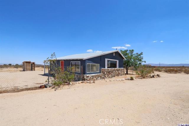 Calling all investors, visionaries and opportunity seekers! The possibilities are endless with this 2 bed 1 bath cabin-like home the heart of Joshua Tree located on 5 usable acres of breathtaking desert landscape. Easily accessible and not too far from the shops and restaurants in booming downtown Joshua Tree, this charming fixer awaits your vision. It definitely needs TLC and repairs but currently has working electricity / water and comes with a septic cert so some of the heavy lifting is done! The lot also has other unfinished structures that could potentially be turned into creative spaces or a dream desert compound! With endless canyon views, tons of character and a prime location this is the hidden gem you've been waiting for.