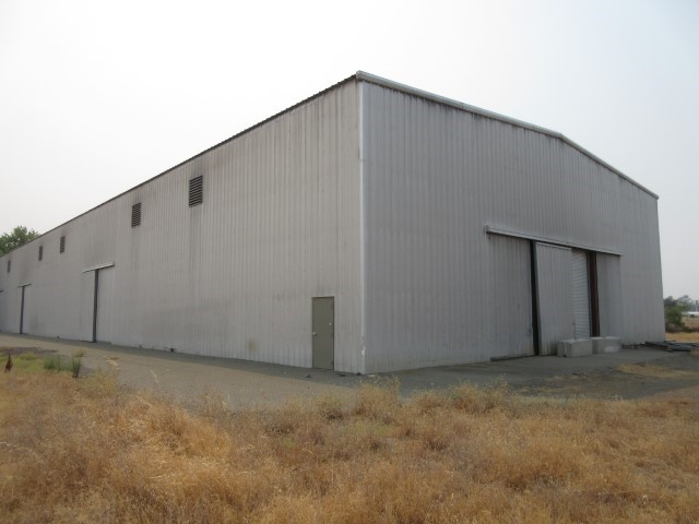 66.96 Acres. This Industrial property consists of 3 different parcels, which was part of the former Koppers Oroville Wood Treatment Facility. The first parcel is 49.71 acres, and includes a metal building with a finished floor, that could benefit most large scale operations; the building is approximately 220ft x 80.6ft with approximately 20-25ft ceiling; there are several large doors, 3 on the easterly approximately 10ft wide x 14ft high; and then there’s a door on the each end of the building, approximately 18ft wide x 15ft high. The other two parcels are 10.55 acres and 6.70 acres. The property includes both paved and graveled roads, several sites with additional concrete pads and all corners have been marked. The 49.71 acre parcel has a gated access to Baggett Marysville Road, and very close to Hwy 70. Many possible uses for this property, buyer to consult with the City of Oroville and EPA for approval.