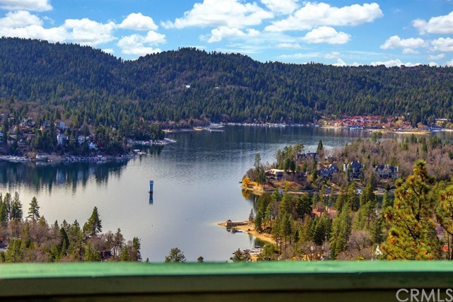 Back up offers are appreciated. AMAZING VIEW! Charming A-Frame style home with the space for the entire crew! Tri-level home with additional mother-in-law quarters. Giant game room, family room, open living room and kitchen, with huge lakeviews. The master suite has an attached loft, and is on its own level for privacy. Secluded behind private gates with a two car attached garage, and terraced style landscaping. Hurry to enjoy this view!